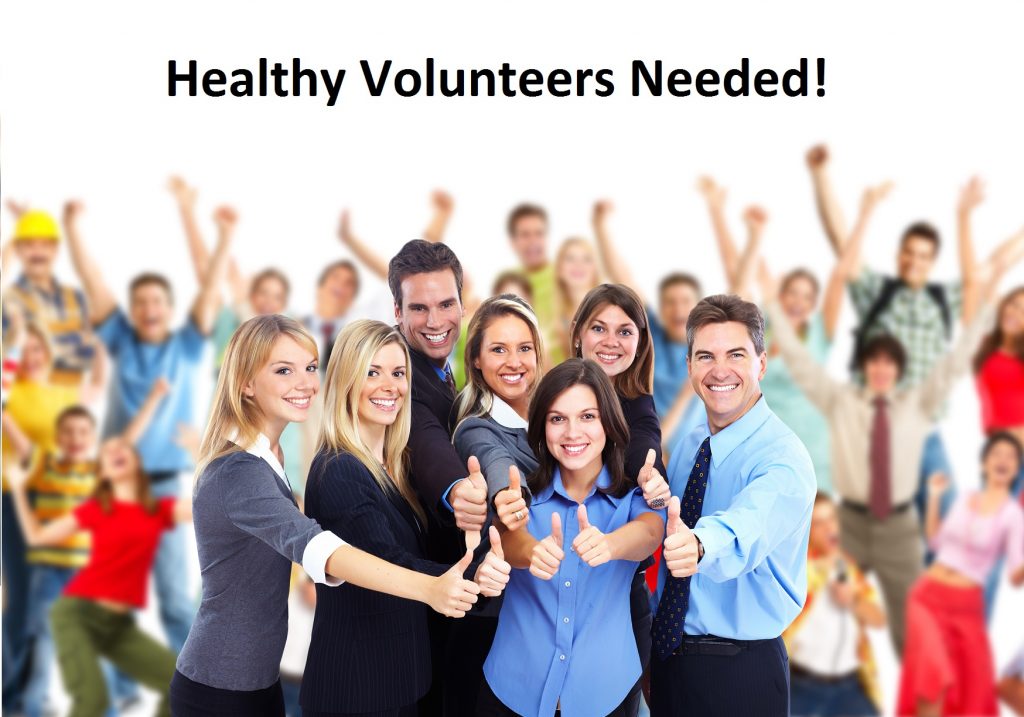 A group of people standing in front of a crowd posing for the camera
Description automatically generated